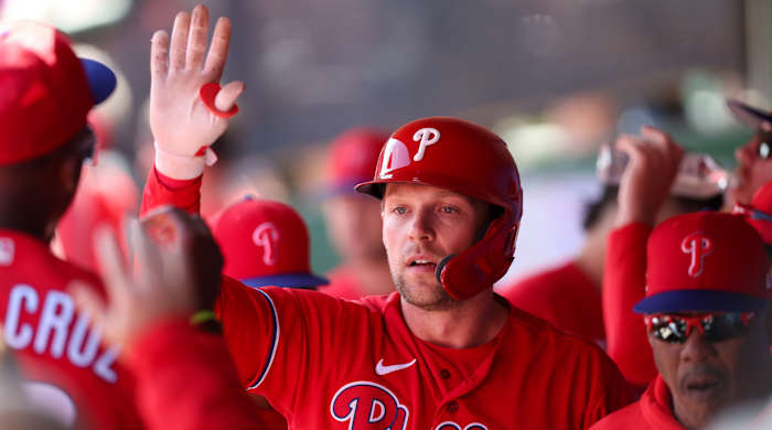 Philadelphia Phillies first baseman Rhys Hoskins (17) is congratulated after hitting a home run against the Boston Red Sox during a spring training game.